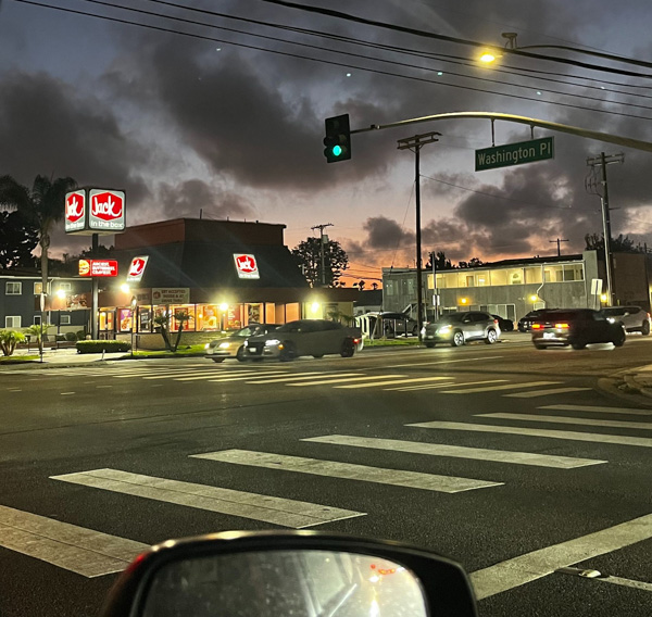 A picture of a street intersection at a traffic light